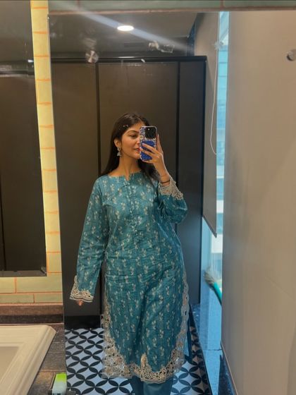 This teal printed kurta set is a comfortable and elegant choice for office wear. The subtle print and gota patti details add a touch of festive flair, perfect for an ethnic day at work.
