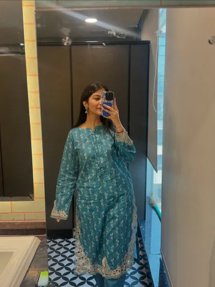 This teal printed kurta set is a comfortable and elegant choice for office wear. The subtle print and gota patti details add a touch of festive flair, perfect for an ethnic day at work.