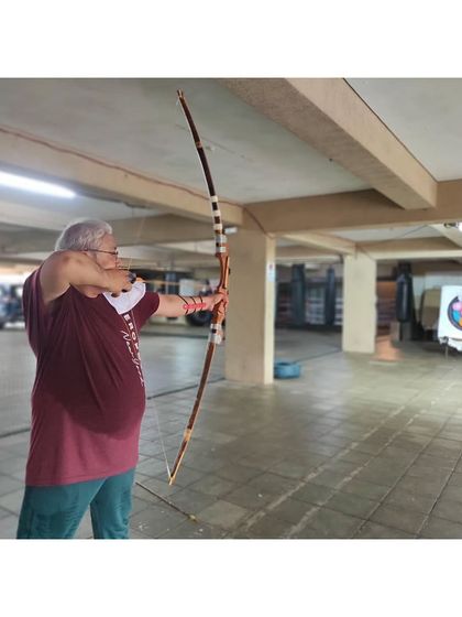 Age is no barrier to learning archery. This gentleman shows perfect focus as he prepares to release his arrow.