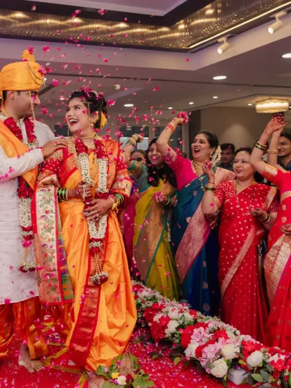 A joyous moment of celebration with the couple being showered with flower petals.