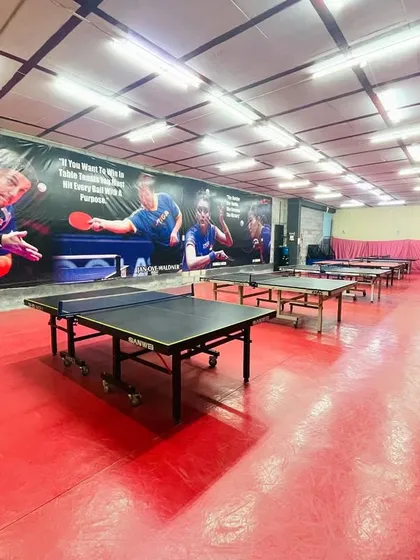 A look at our professional training hall. We have multiple high-quality tables and a floor designed for competitive play, giving you the space and setup needed to focus on your game.