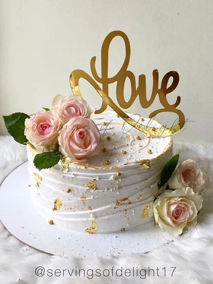 All you need is love and cake! This beautiful white and gold cake with fresh pink roses is perfect for an engagement, wedding, or anniversary.