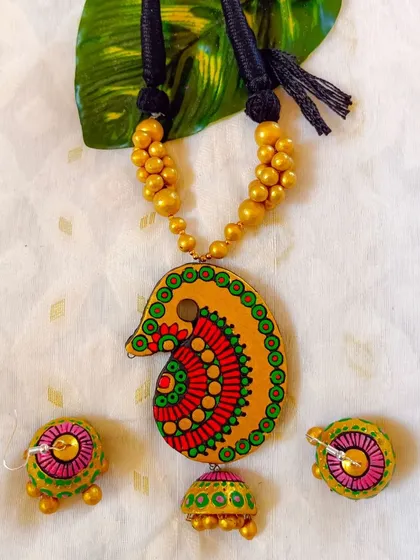 This version of the 'kalka' motif necklace is in a cheerful yellow, green, and red.