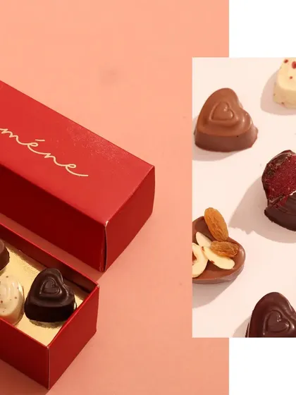 A detailed shot focusing on a box of assorted heart-shaped bonbons. The image on the right reveals the delicious filling inside, giving customers a tempting preview of the product.