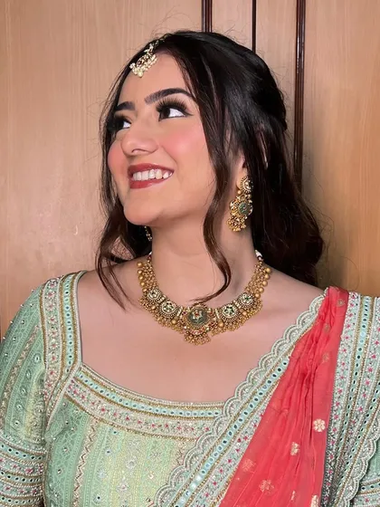 A happy, smiling shot of this client, her makeup looking effortlessly beautiful.