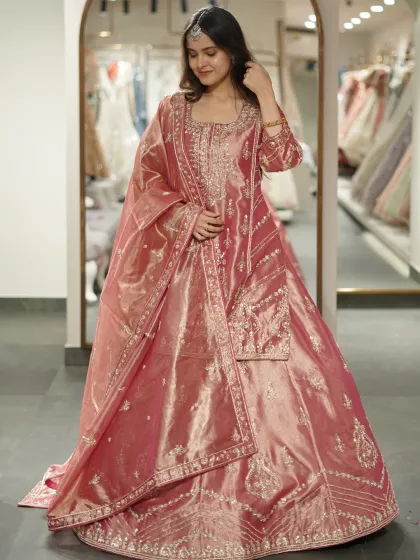 Not your usual ethnic, but definitely unforgettable. This shiny pink sharara set is a modern take on a classic silhouette.