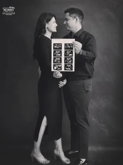 The first family photo. This sweet black and white shot of the couple holding their ultrasound scans is a beautiful way to announce and celebrate their growing family.