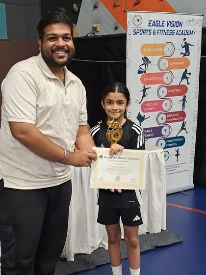 Cloe, our U-9 winner, receiving her first-place trophy at the Corporate Sports Connect Tournament. It is always a joy to see our youngest players achieve their goals.