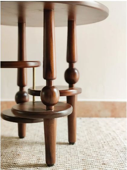 More views of the Vibhinna Side Table, showcasing its intricate craftsmanship and unconventional design, perfect for adding a point of interest to any living room corner.