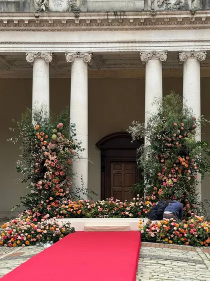 Our team putting the finishing touches on the mandap at Hampton Court Palace. This behind-the-scenes shot shows the hard work that goes into creating a flawless event.