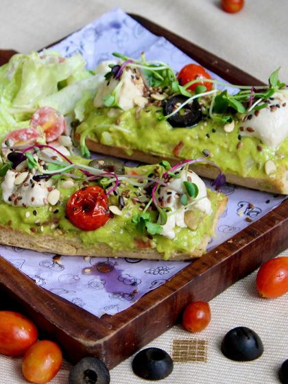 Our Avocado Toast with Pesto is an elevated culinary experience. It features in-house guacamole and delicious vegan feta on a perfectly toasted baguette, garnished with nutrient-rich seeds and microgreens.