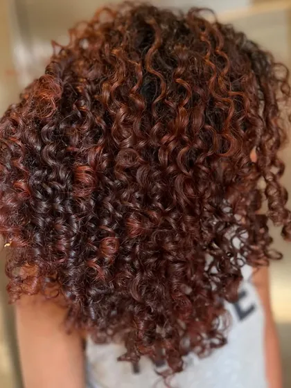 This is my Pumpkin Spice look, perfect for adding warmth to curly hair. The rich auburn and copper tones are woven through the curls to create dimension and a cozy, fall-inspired vibe.