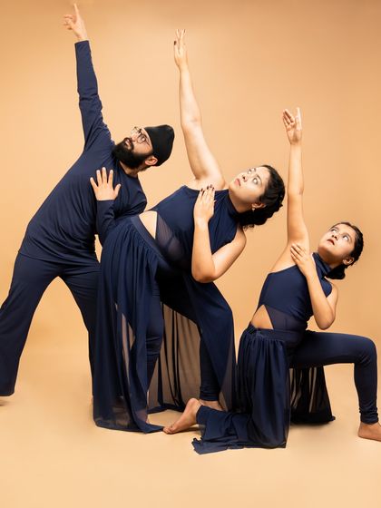 A dynamic pose from 'Momentum', showcasing the balance between stillness and motion. Our adult performers bring maturity and depth to their stage presence.