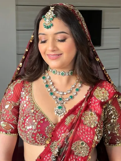 Eyes closed, the soft shimmer on her lids catches the light. This ethereal look was all about subtle definition, ensuring she looked radiant from every angle.