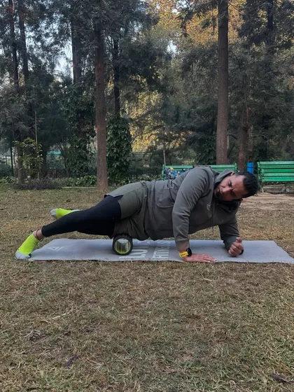 Using a foam roller to release the IT band, a common tight spot for runners.
