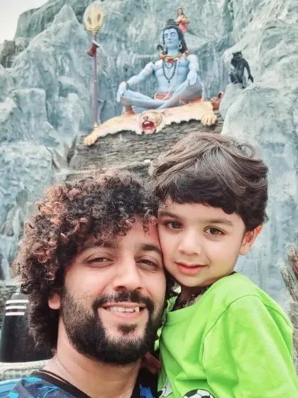 A happy selfie with my son during our visit to a Shiva temple. It's a blessing to share these spiritual experiences with him and to bring that same family-centric devotion to your events.