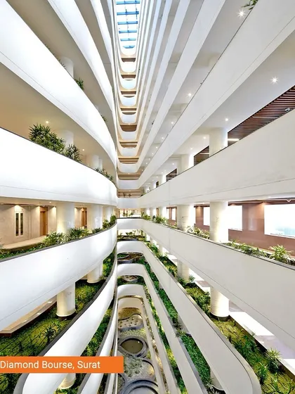 The interior of the Surat Diamond Bourse reveals a vast, multi-level space designed for community and commerce. The flowing balconies and integrated planters create a vibrant internal ecosystem, demonstrating how we design for human interaction on a massive scale.