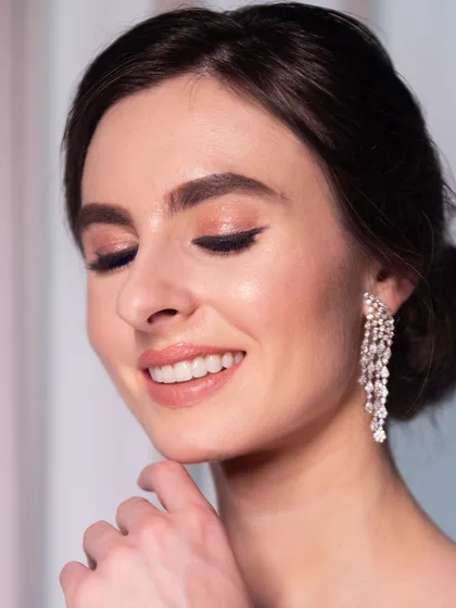 A beautiful close-up showcasing the soft, blended eyeshadow and flawless skin, perfect for a sophisticated evening event.