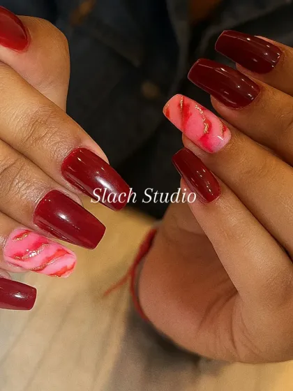 For those who love a bold statement, I combined a deep, glossy burgundy with accent nails featuring a pink and red marble effect, highlighted with delicate gold foil. This design on coffin nails is both glamorous and modern.