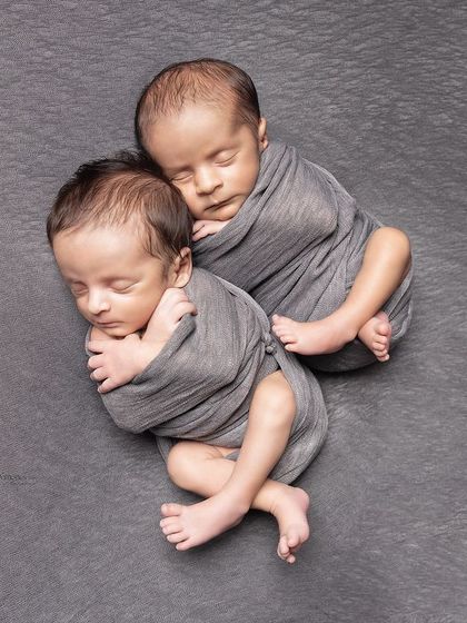 Double the joy, double the love. Watching these twins nestle together with that magical bond reminds me of the beauty and serenity that comes with new life.
