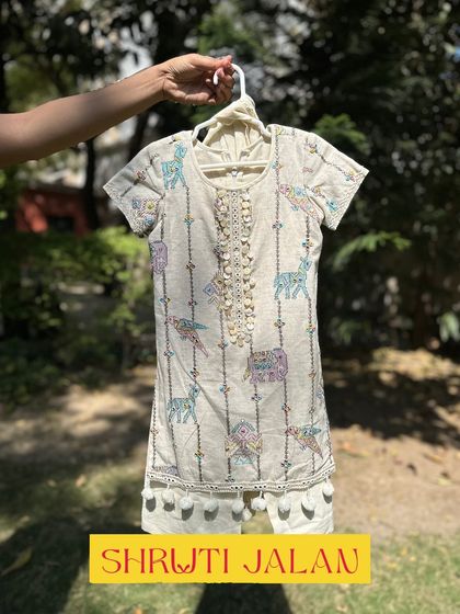 This charming kurta set features a unique print of colorful animals. The soft fabric and playful design make it a favorite for both kids and parents.