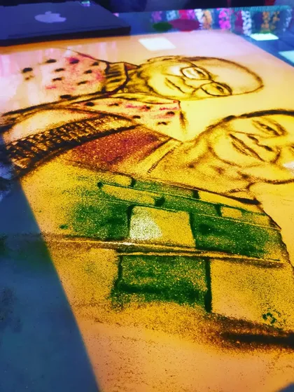 Celebrating a beautiful 61st wedding anniversary by telling a couple's life story in sand. It is a joy to create such personal and emotional gifts that families can cherish forever.