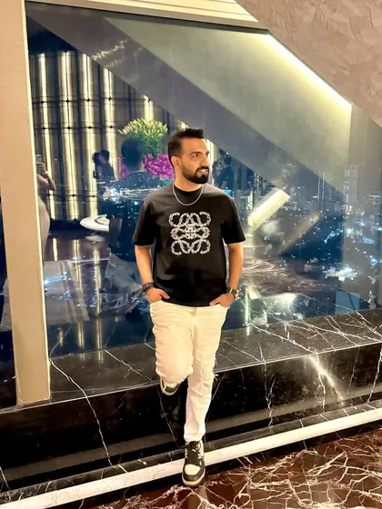 Down to earth, but still above you. A casual but stylish look for a night out in Mumbai with a great city view.