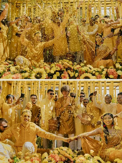 The pure, unadulterated joy of a Haldi ceremony. This candid shot captures the couple and their loved ones amidst a shower of flower petals and turmeric, embodying the fun and vibrant spirit of pre-wedding festivities.