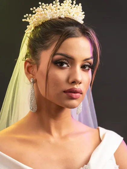 This shot plays with colored lighting, a scenario often encountered at wedding events. Students learn how makeup translates under different lights.