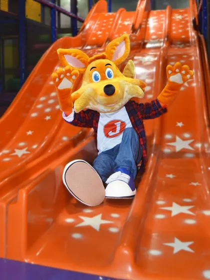Look who's joining the fun. Our friendly mascot, J the Fox, loves to surprise the kids, sliding down and joining the party to make birthdays and events extra special.