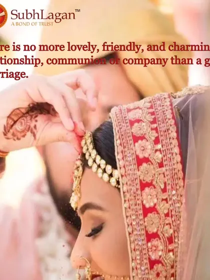 Another perspective of the sindoor daan, capturing the groom's gentle gesture and the bride's serene expression. It's a testament to the beautiful traditions we uphold in our matrimonial services.