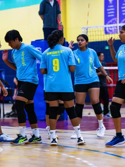 On-court communication is key. Here, our players strategize between points, ensuring everyone is on the same page.