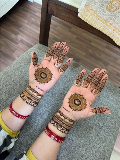 A beautiful mandala design on the palms, a classic choice for festive celebrations.