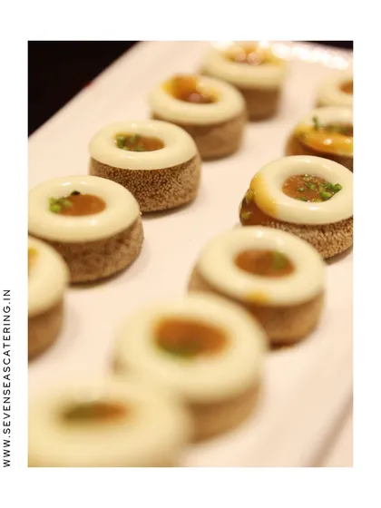 Bite-sized luxury. These miniature cakes with a white chocolate topping are a perfect example of how we layer flavour and finesse.