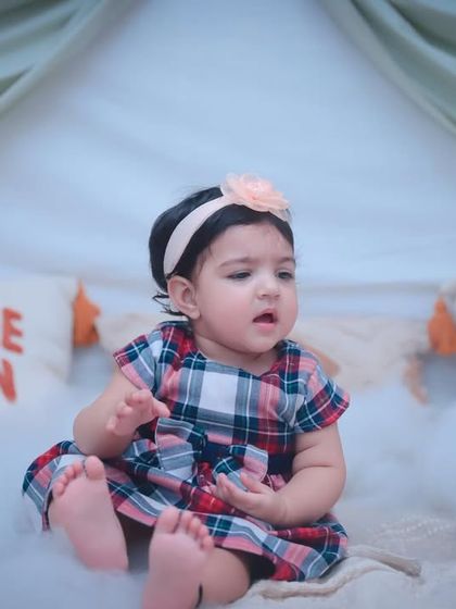 A sweet portrait of a baby girl in our cozy studio setup. The soft lighting and gentle colors create a warm and inviting feel.