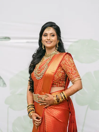 Our beautiful bride Manasa, looking radiant in a traditional red Kanjeevaram saree paired with a bespoke, heavily embroidered blouse I designed for her Muhurtham ceremony.
