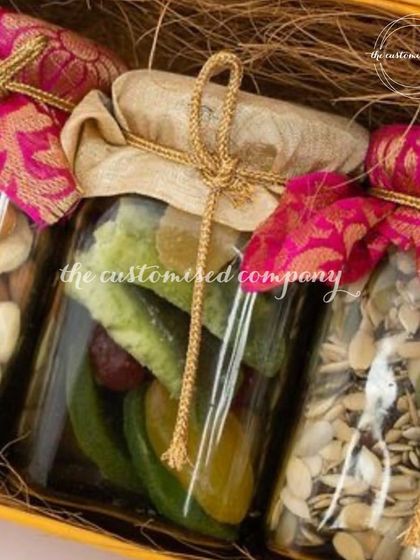 A close-up of the heart of many of my hampers: premium quality dry fruits and seeds. I present them in beautiful glass jars, decorated with traditional brocade fabric caps to enhance the festive feel.