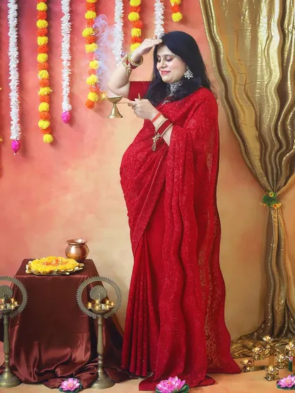 A beautiful pose capturing the mother-to-be offering prayers. The entire setup, with marigold garlands and brass diyas, is designed to celebrate our rich cultural heritage.
