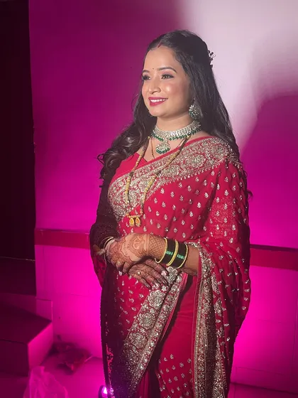 A happy and confident reception bride. The makeup is glamorous and designed to look amazing in photos.