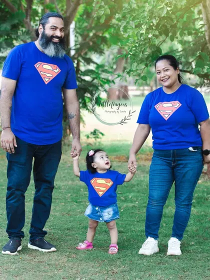 A super family. I love when families coordinate their outfits, like these fun Superman t-shirts. It adds a playful and unified look to the family portraits.