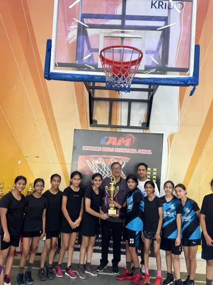 Our girls' team posing with their championship trophy after a successful tournament run. We focus on building winning teams.