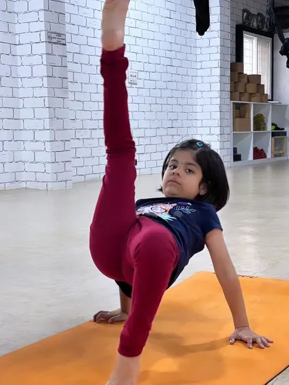 This dynamic standing split variation shows incredible focus and developing strength. We work on poses like this to improve balance and body awareness in a safe and encouraging environment.