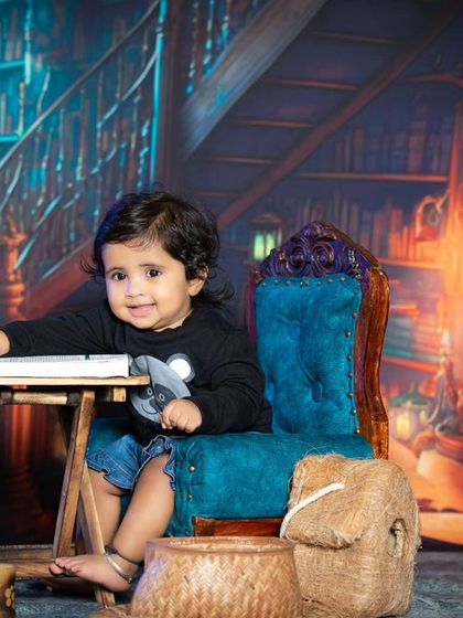 A curious look from a baby in the library setting.