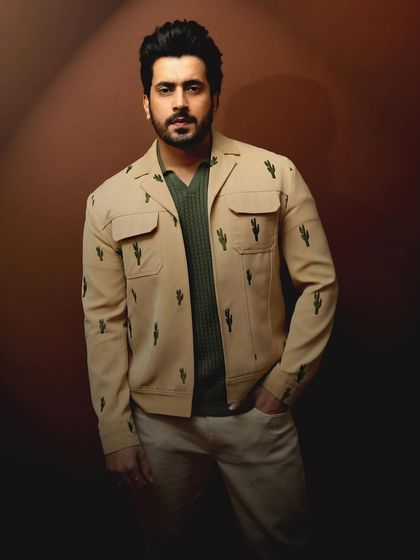 A closer shot from the same set, highlighting the unique cactus embroidery on his jacket.