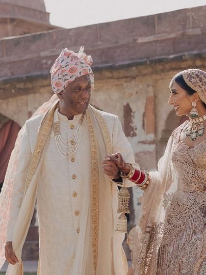 A touching moment as the bride walks with her father towards the wedding ceremony.