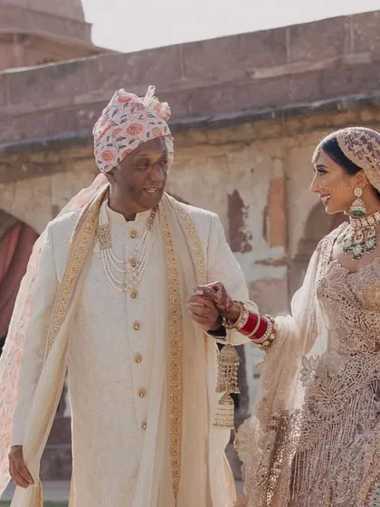 A touching moment as the bride walks with her father towards the wedding ceremony.