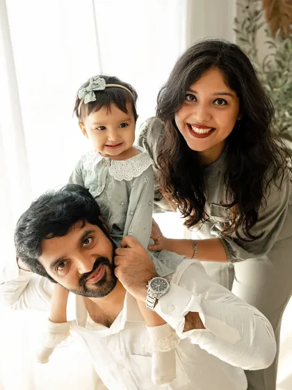 A sweet and happy family portrait. The love and connection are so clear as this family celebrates their daughter's first year together in the studio.