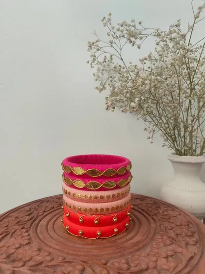 A beautiful set of bangles in shades of pink and red. I used different techniques here, including gota patti and simple beadwork, to create a varied and interesting stack.