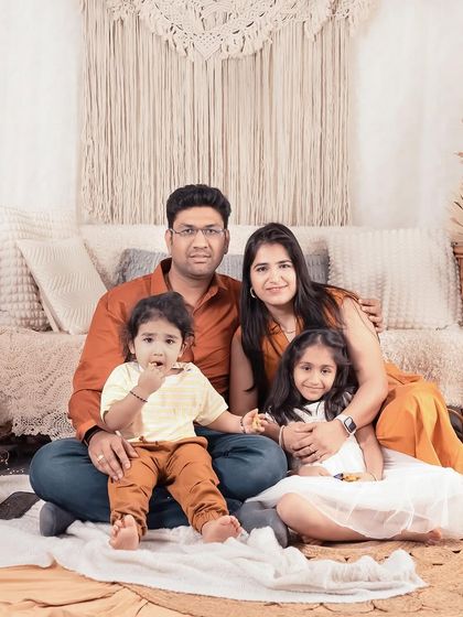 A warm family portrait in my boho-themed studio. The earthy tones and textures create a cozy and inviting atmosphere for creating memories.