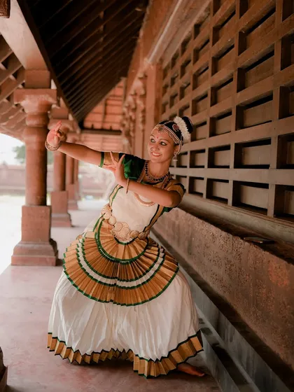 A duplicate of image 17, this portrait of a Mohiniyattam dancer captures the grace of the pose and the beauty of the traditional costume.